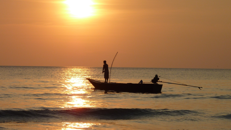 Fishermen at sunset in the Solomon Islands