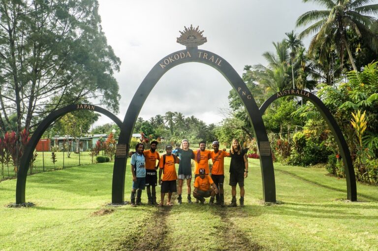 Visitors at the Kokoda Trail landmark in Papua New Guinea
