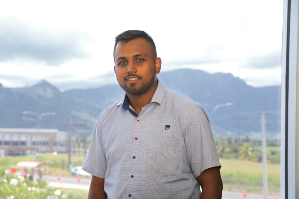A guy with mountains as background