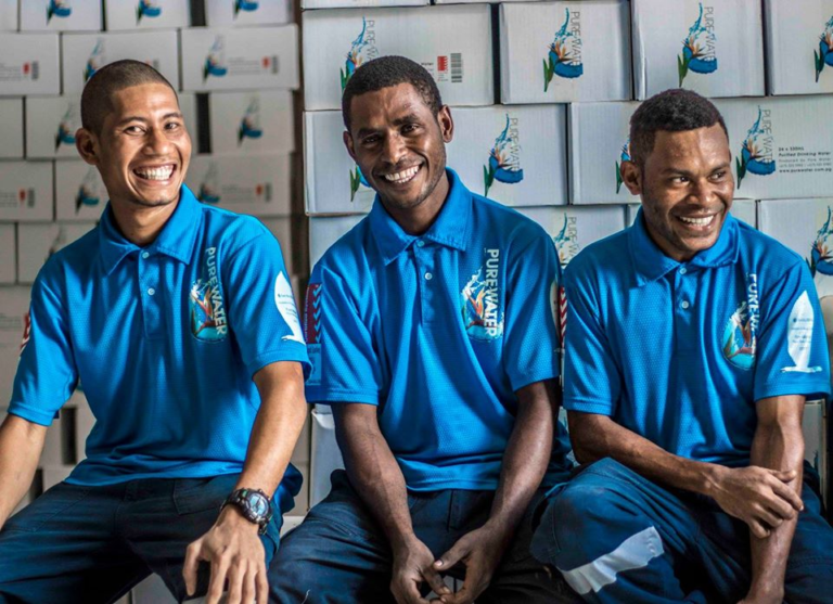 Pure Water Team members at the factory in PNG