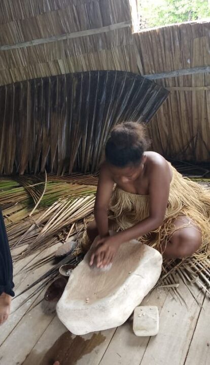 Artisan grinding shells by hand