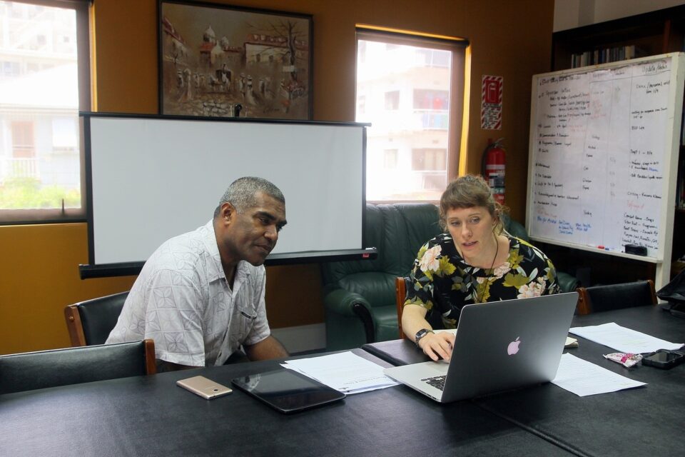 Man and women working together in office