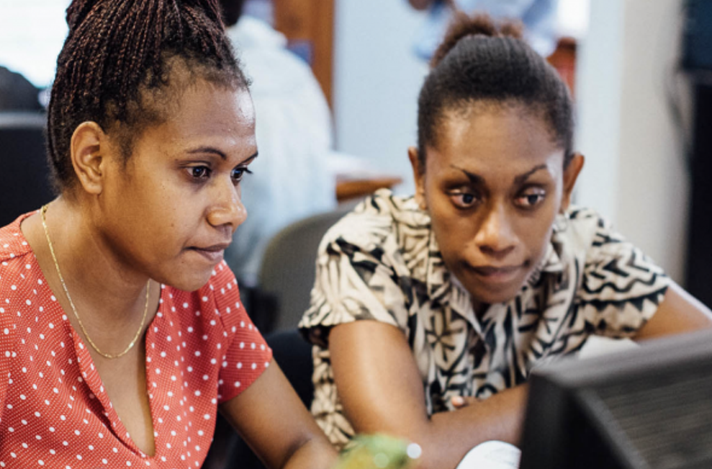 two women are fixing a small issue