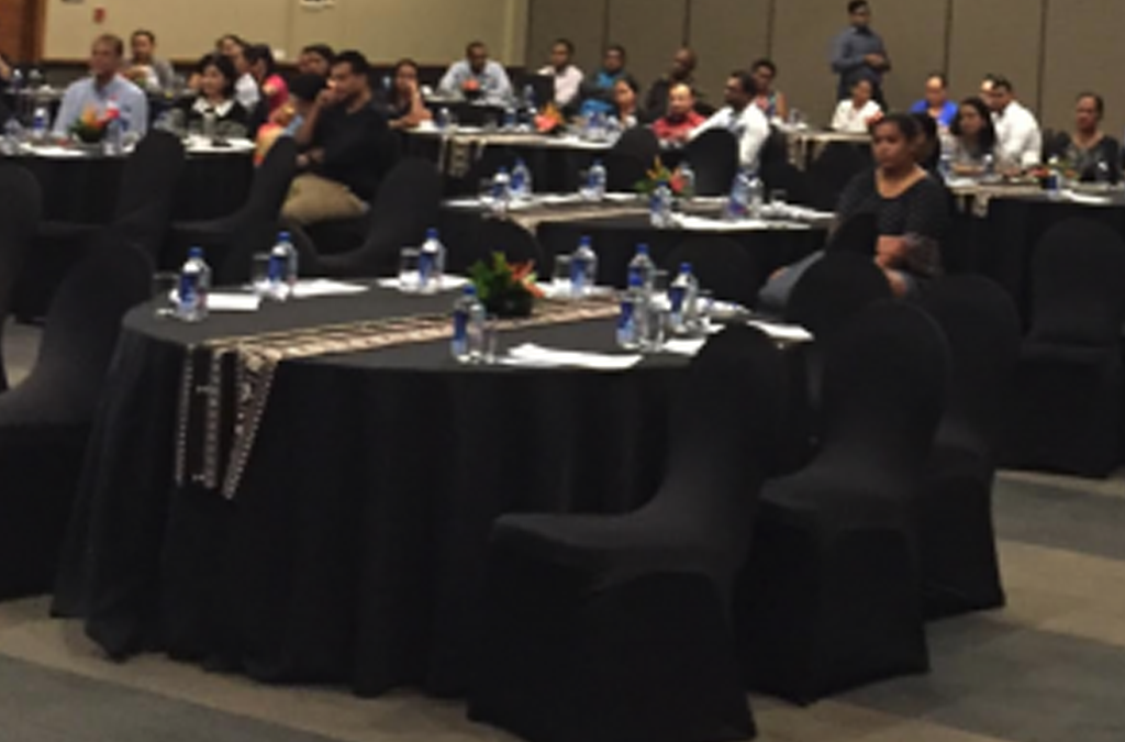 conference attendees in a big meeting room