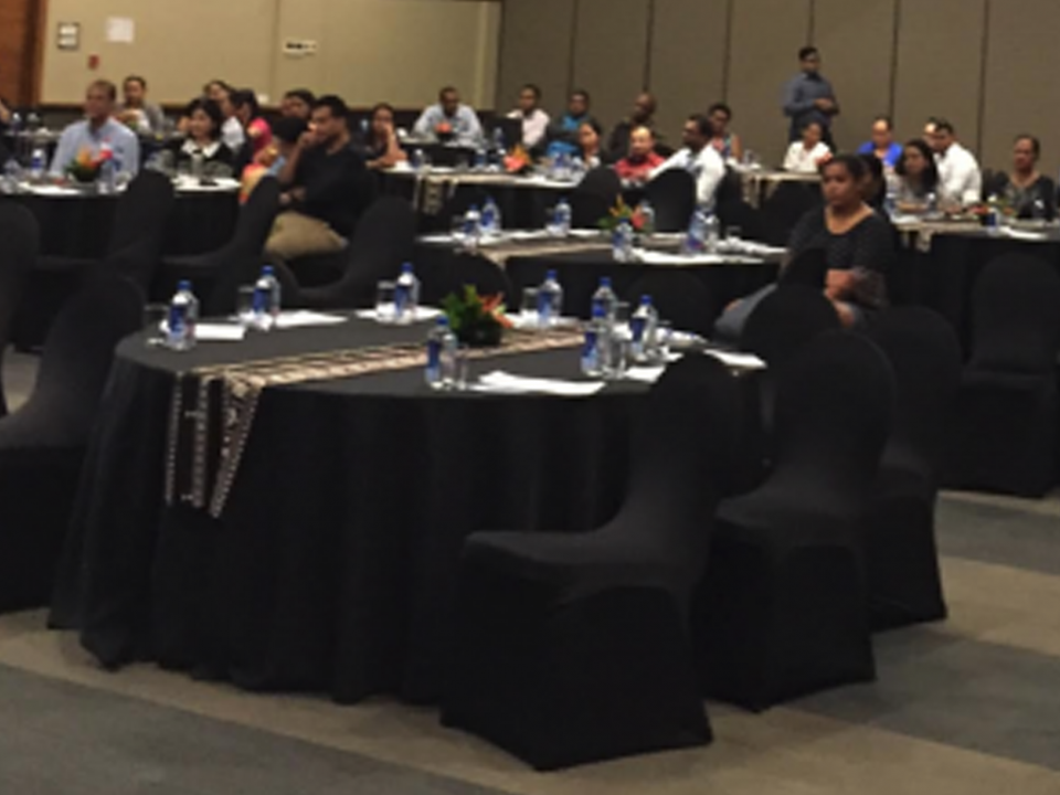 conference attendees in a big meeting room