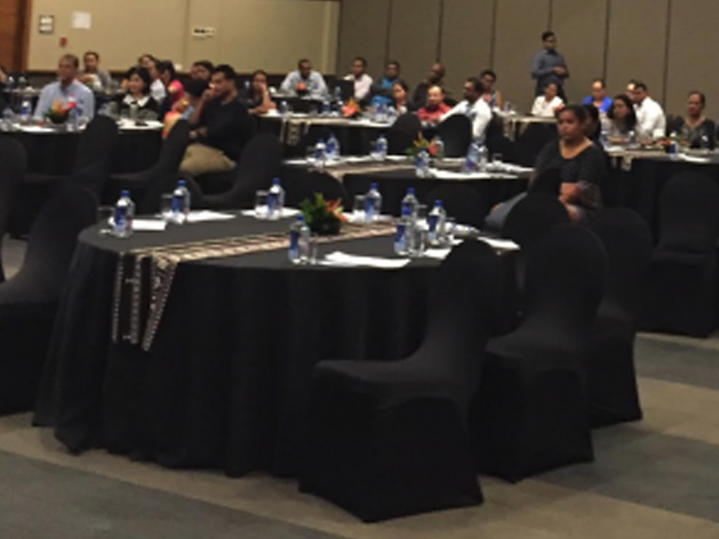 conference attendees in a big meeting room