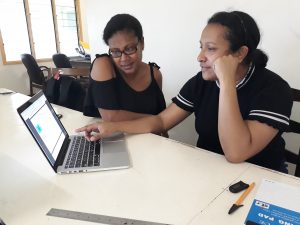 a couple of women working together in a new project