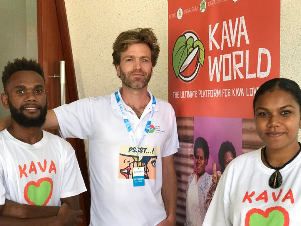 three people at the banner of an event