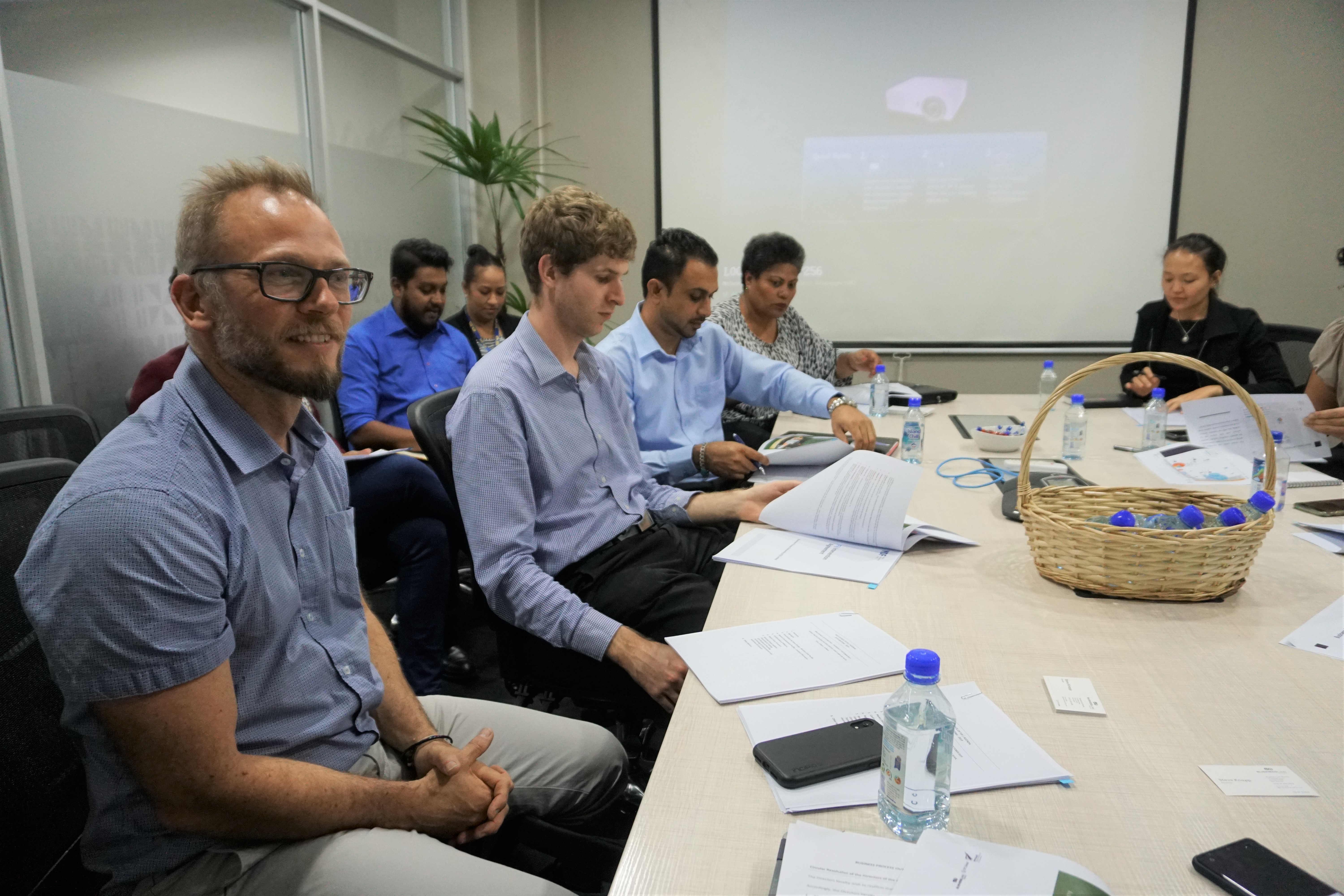 Group of workers at the meeting table