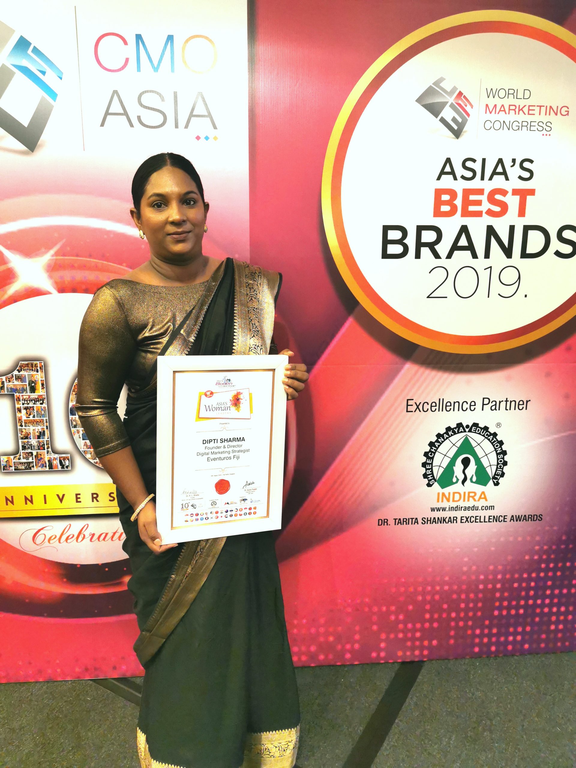 An Indian woman is receiving an award for Asia's Best Brands 2019
