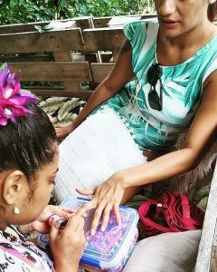 Betta Beauty, mobile beautician doing a clients nails