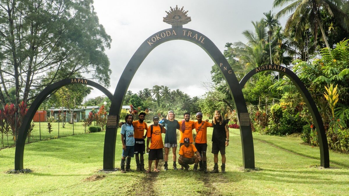 Visitors at the Kokoda Trail landmark in Papua New Guinea